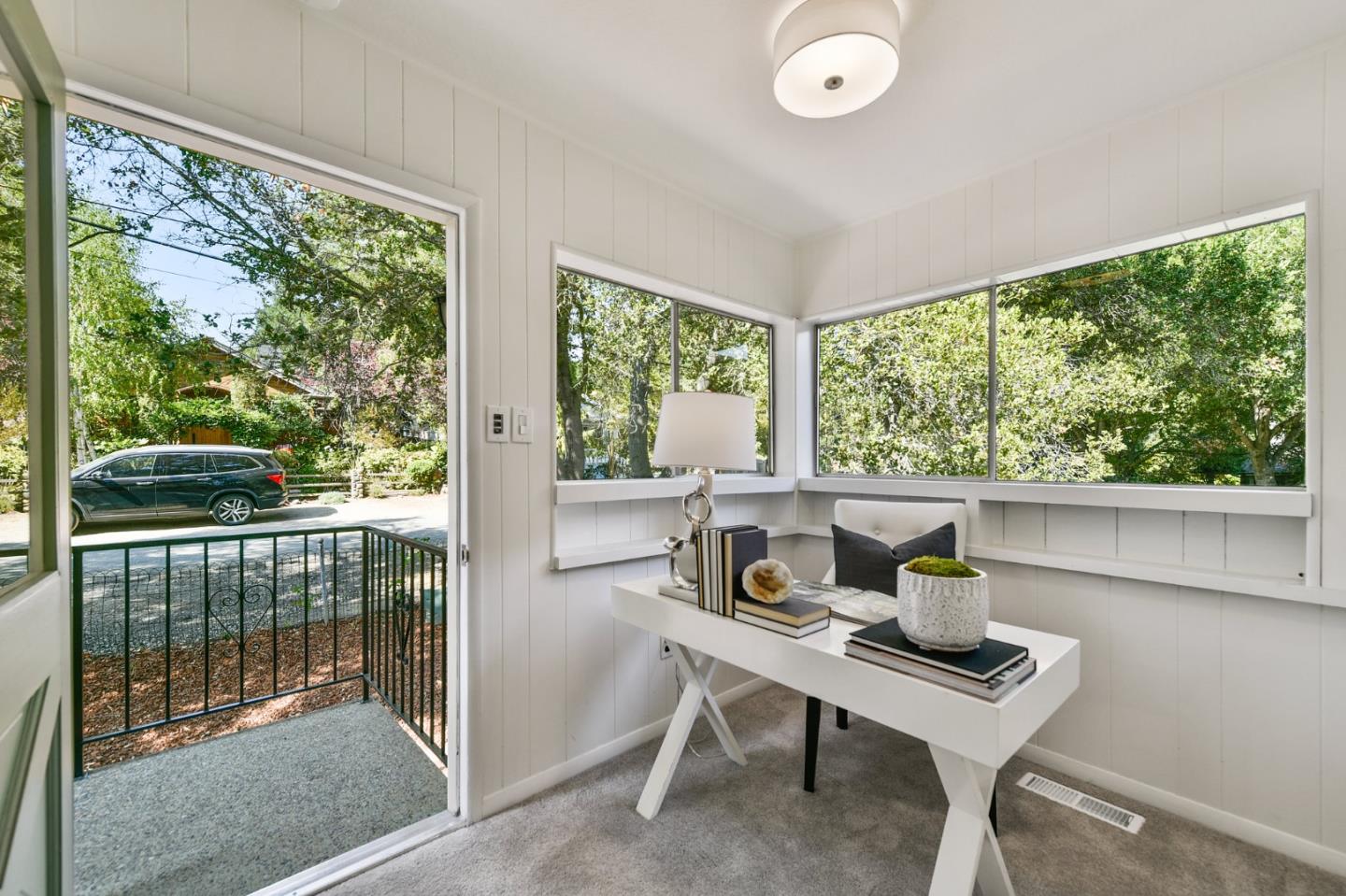 132 Alta Vista Road Woodside, CA 94062 - Photo 19 of 44 a view of a city from a dining room with large windows