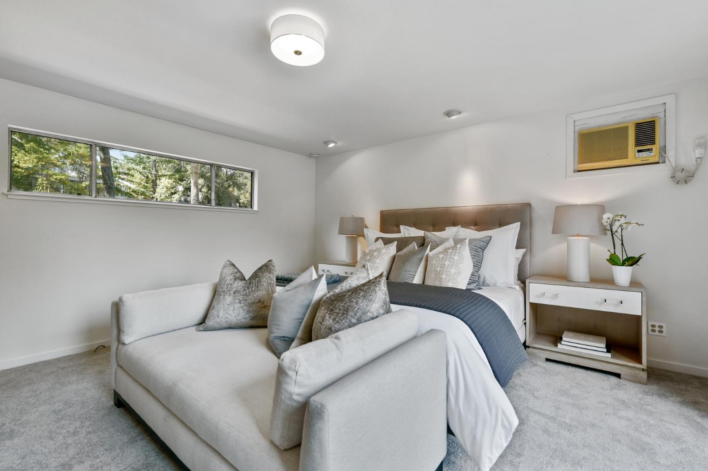 132 Alta Vista Road Woodside, CA 94062 - Photo 20 of 44 a large bed sitting in a bedroom next to a window