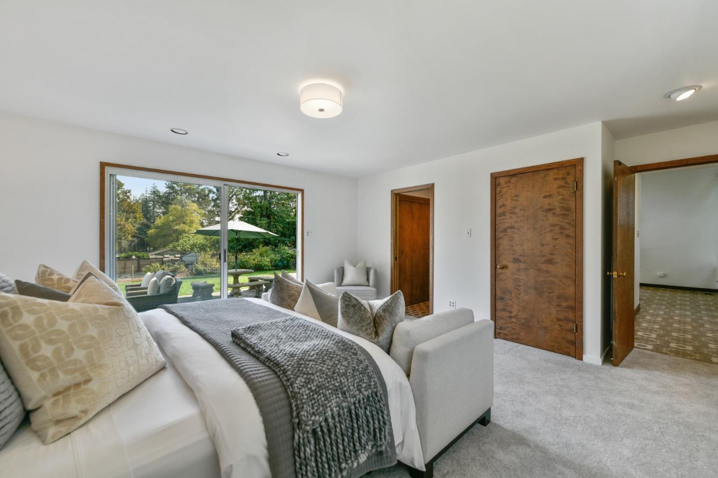 132 Alta Vista Road Woodside, CA 94062 - Photo 21 of 44 a bed room with a bed and a large window