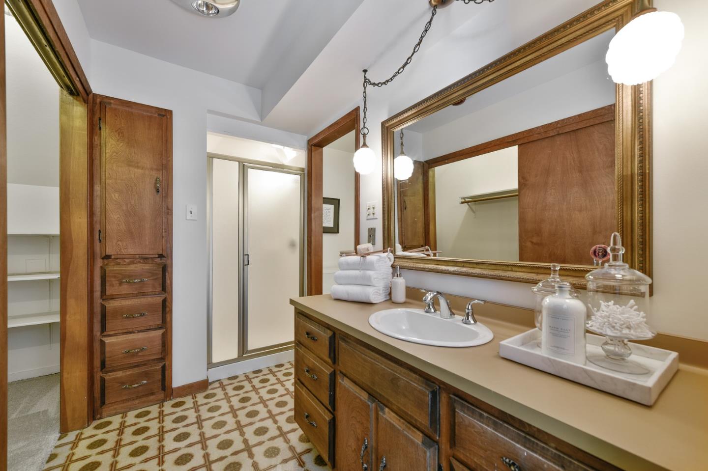 132 Alta Vista Road Woodside, CA 94062 - Photo 22 of 44 a bathroom with a sink a mirror and a shower