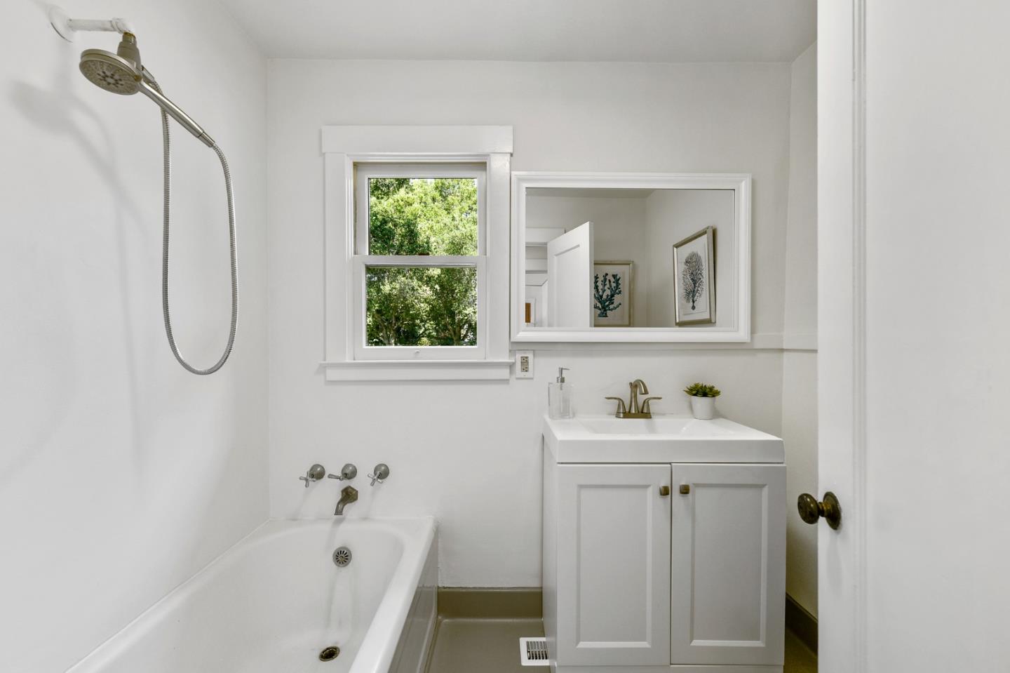 132 Alta Vista Road Woodside, CA 94062 - Photo 27 of 44 a bathroom with a sink a window and a shower