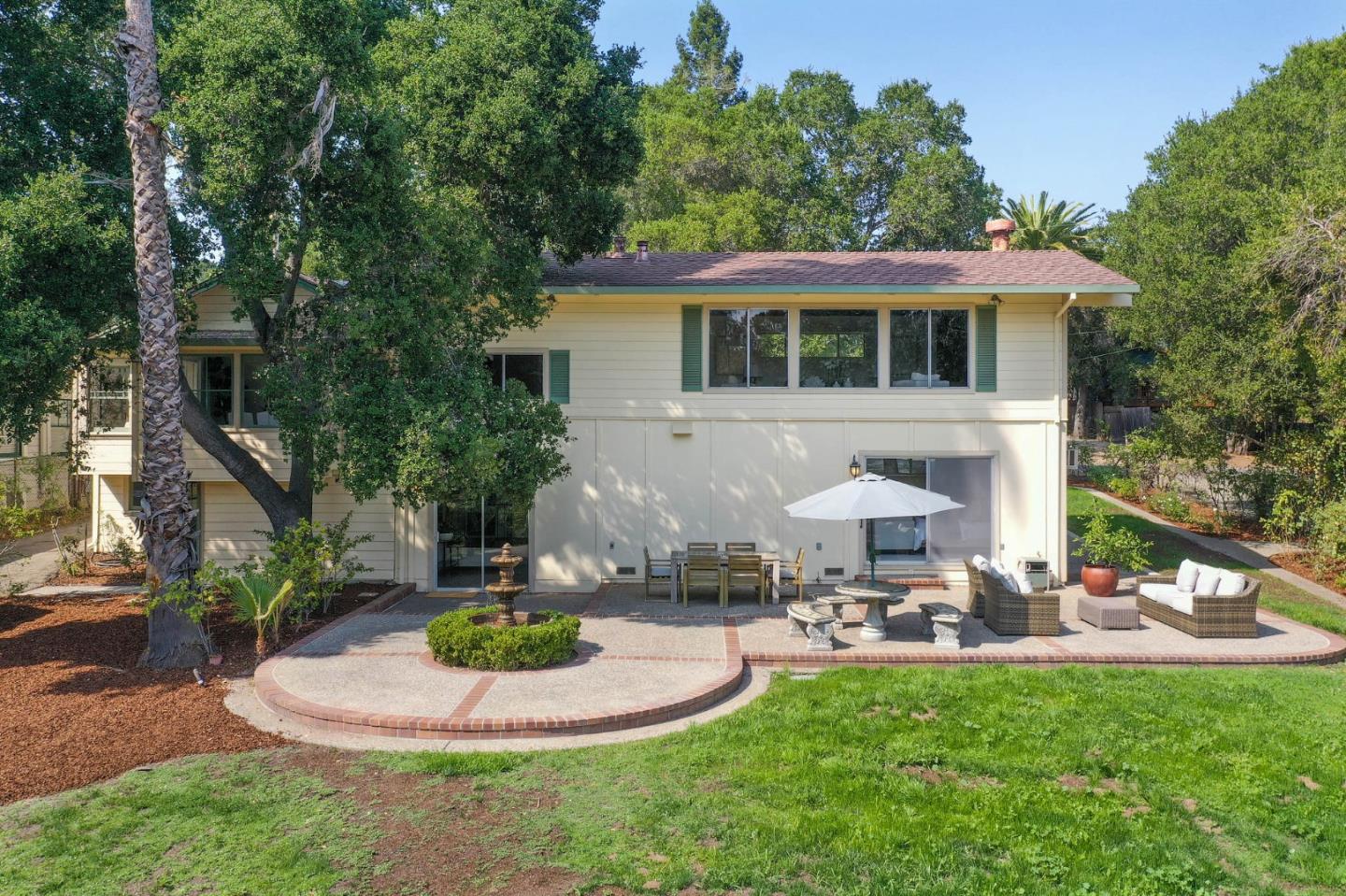 132 Alta Vista Road Woodside, CA 94062 - Photo 30 of 44 a table and chairs in a patio