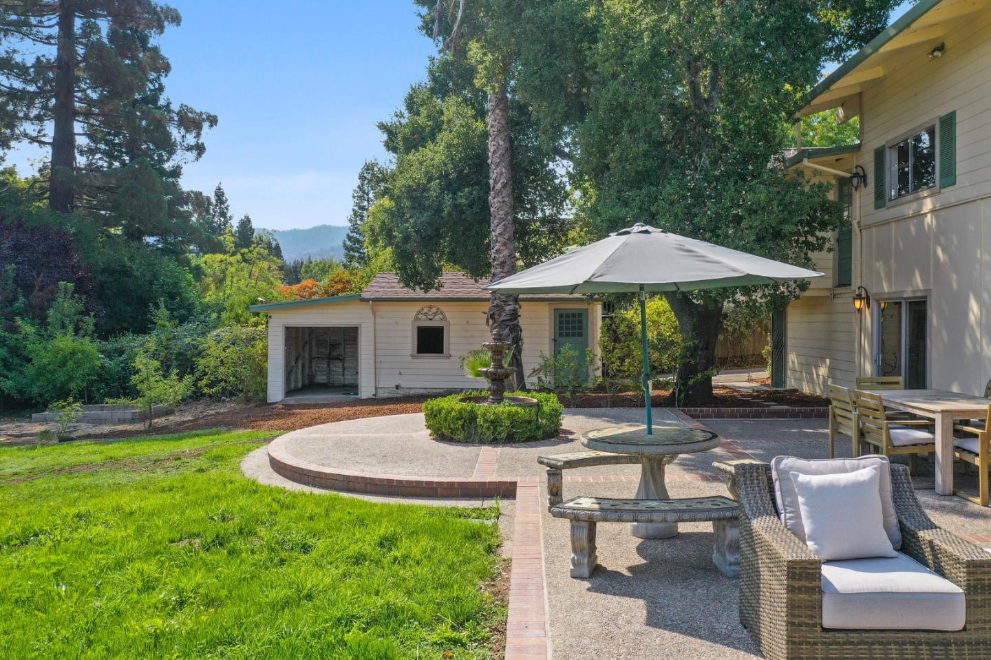 132 Alta Vista Road Woodside, CA 94062 - Photo 32 of 44 a view of house with backyard entertaining space and garden