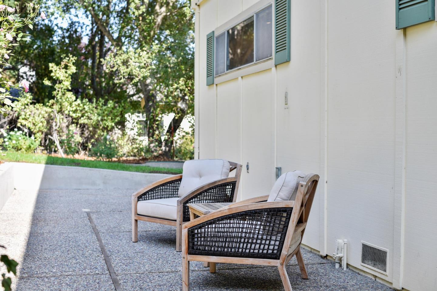 132 Alta Vista Road Woodside, CA 94062 - Photo 33 of 44 a view of a patio with a table and chairs