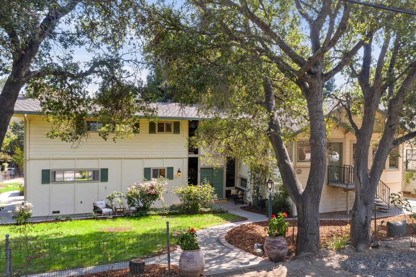 132 Alta Vista Road Woodside, CA 94062 - Photo 41 of 44 a front view of a house with garden