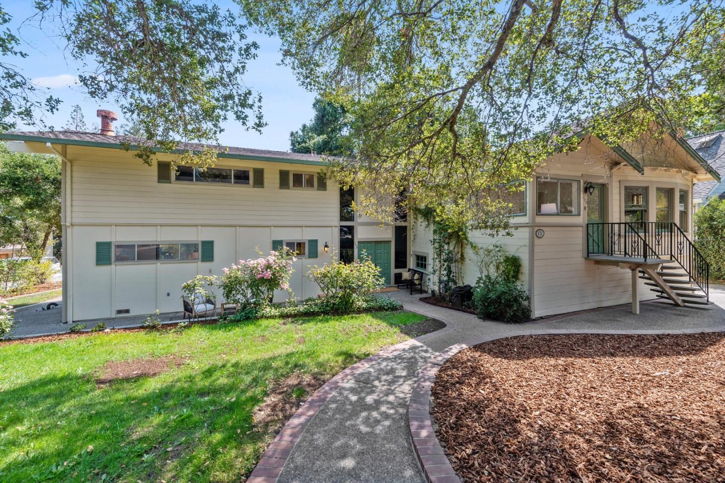 132 Alta Vista Road Woodside, CA 94062 - Photo 42 of 44 a front view of a house with a garden