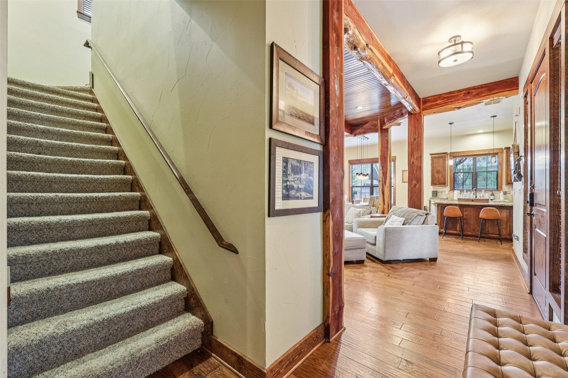 7229 Trident Jonestown, TX 78645 - Photo 16 of 34 a view of entryway and hall with wooden floor