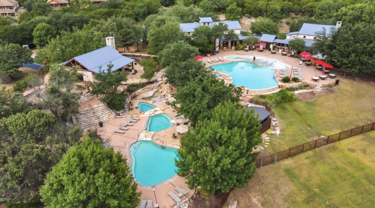 7229 Trident Jonestown, TX 78645 - Photo 30 of 34 an aerial view of a house with a swimming pool yard and outdoor seating
