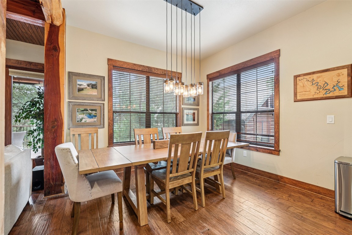 7229 Trident Jonestown, TX 78645 - Photo 6 of 34 a view of a dining room with furniture window and wooden floor