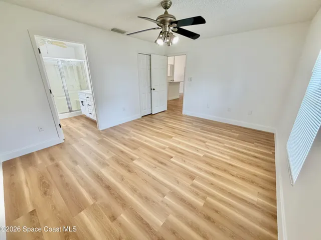 a bathroom with a shower and a sink