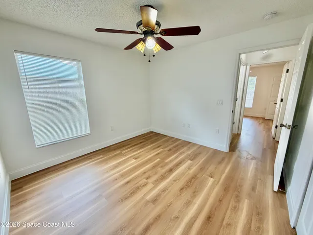 a view of a house with backyard and porch