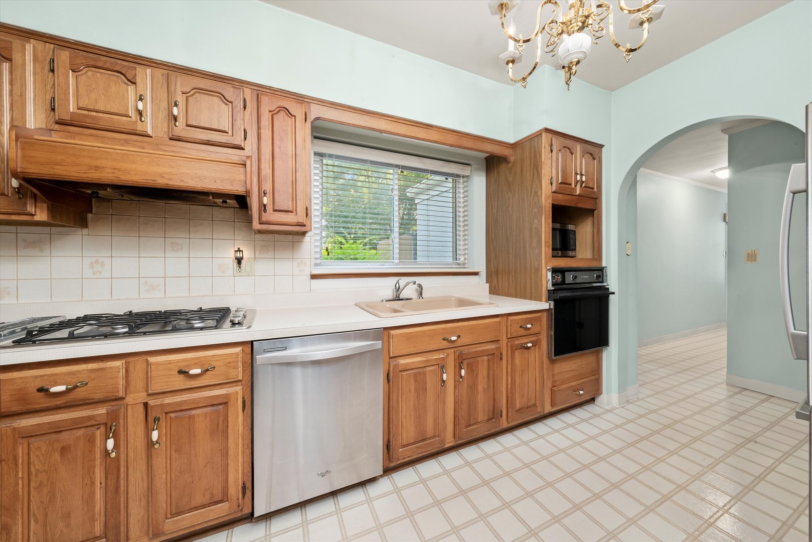 229 Country Club Road Chicago Heights, IL 60411 - Photo 11 of 31 a kitchen with stainless steel appliances granite countertop a stove a sink and a refrigerator