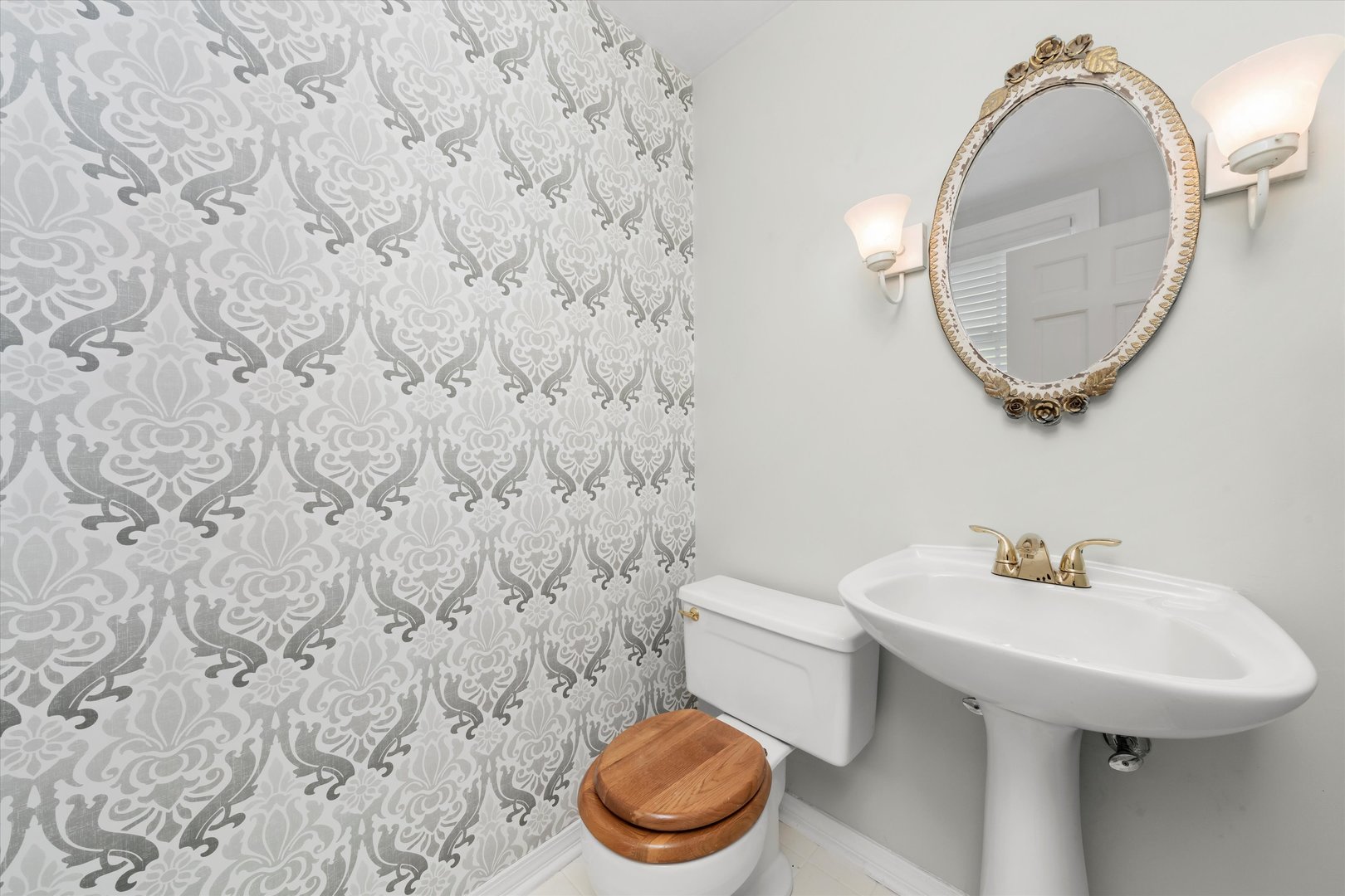 229 Country Club Road Chicago Heights, IL 60411 - Photo 15 of 31 a bathroom with a sink a toilet and a mirror