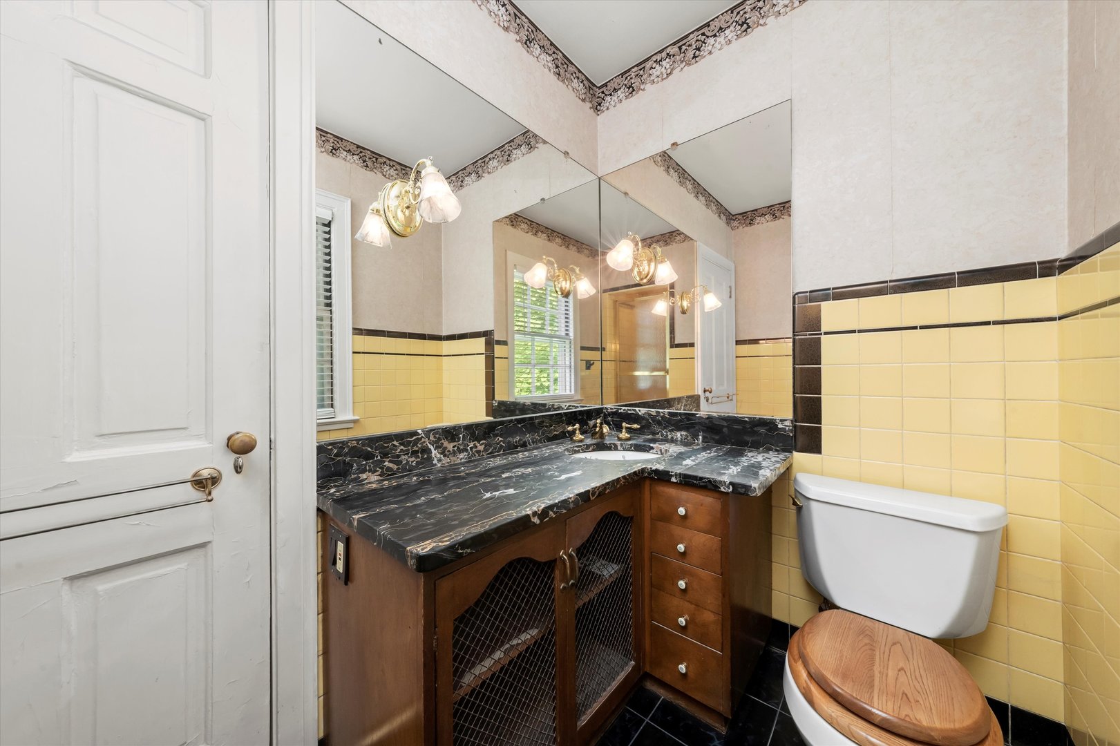 229 Country Club Road Chicago Heights, IL 60411 - Photo 24 of 31 a bathroom with a granite countertop toilet sink and mirror