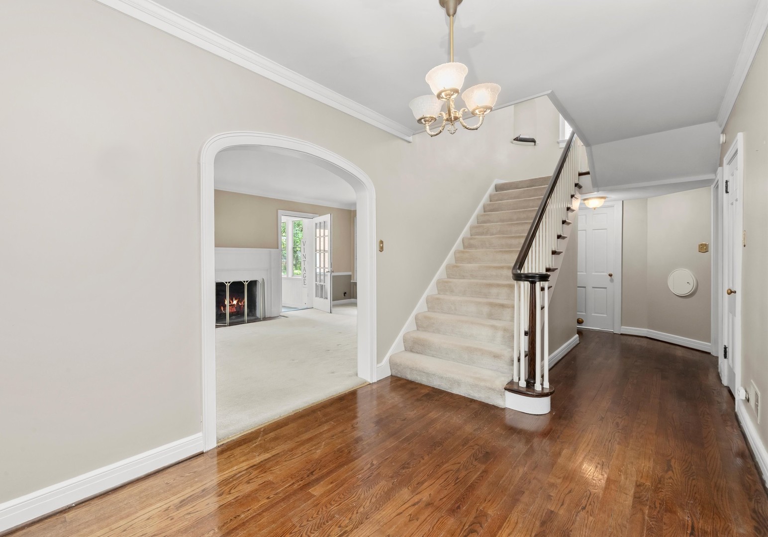 229 Country Club Road Chicago Heights, IL 60411 - Photo 5 of 31 wooden floor in an empty room with a chandelier