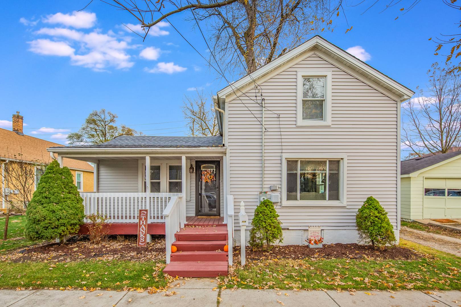 718 Clinton Street Lockport, IL 60441 - Photo 1 of 15 a front view of a house with a yard