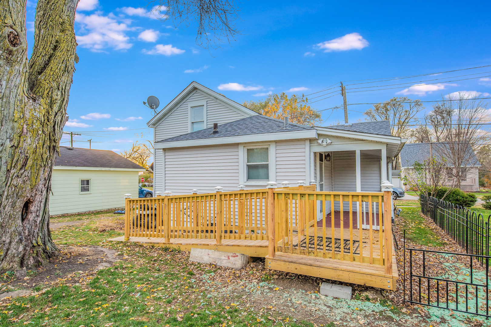 718 Clinton Street Lockport, IL 60441 - Photo 14 of 15 a front view of a house with a garden