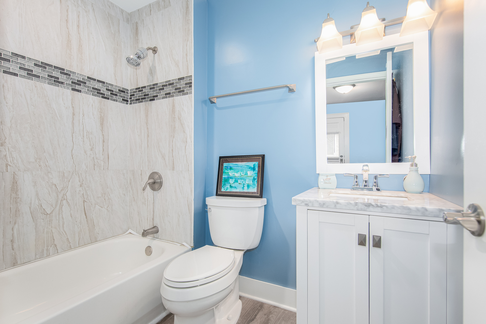 718 Clinton Street Lockport, IL 60441 - Photo 8 of 15 a bathroom with a granite countertop sink a toilet and shower