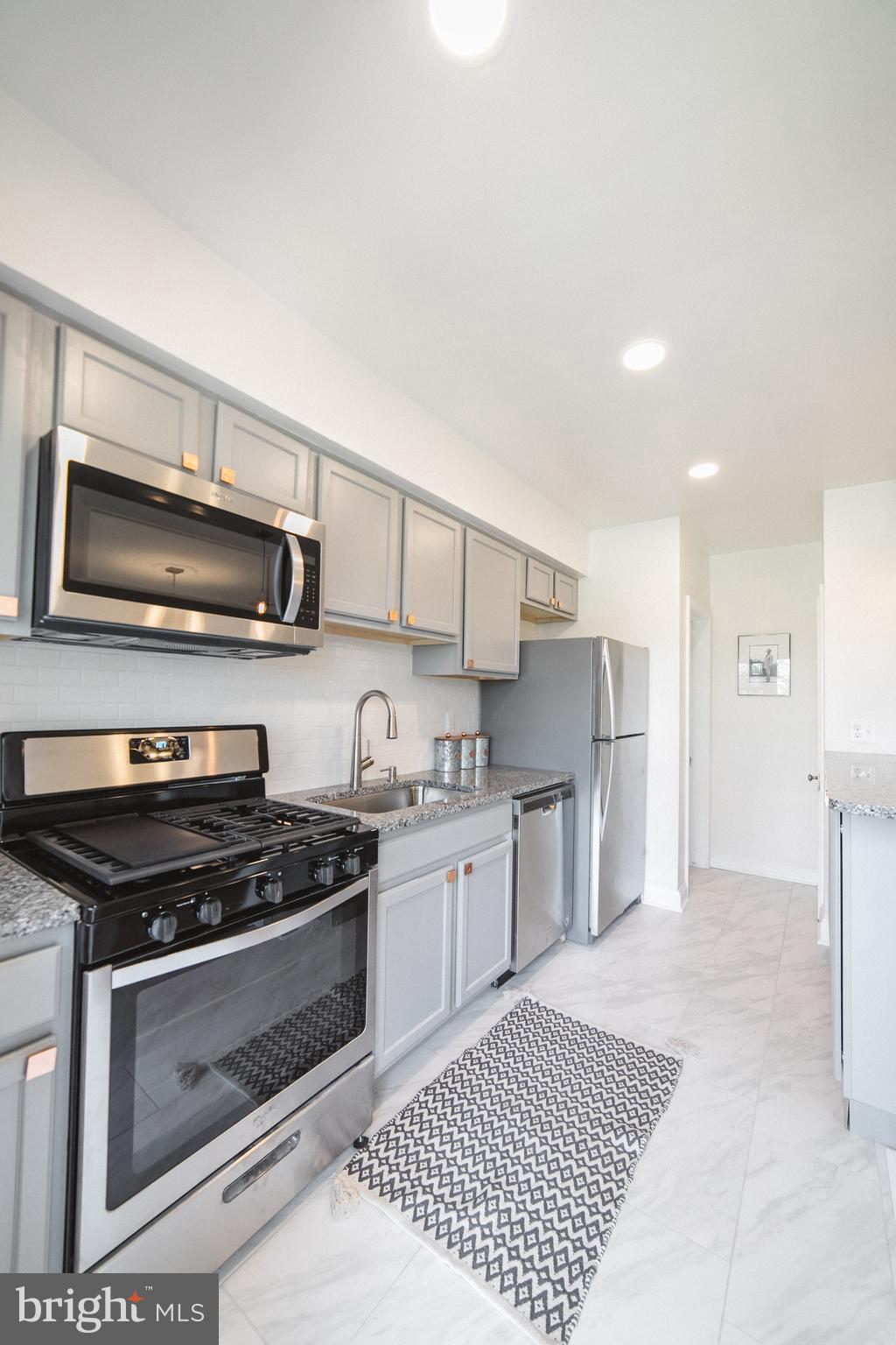 1332 Northview Road Baltimore, MD 21218 - Photo 11 of 30 Gorgeous kitchen w-granite and copper accents.