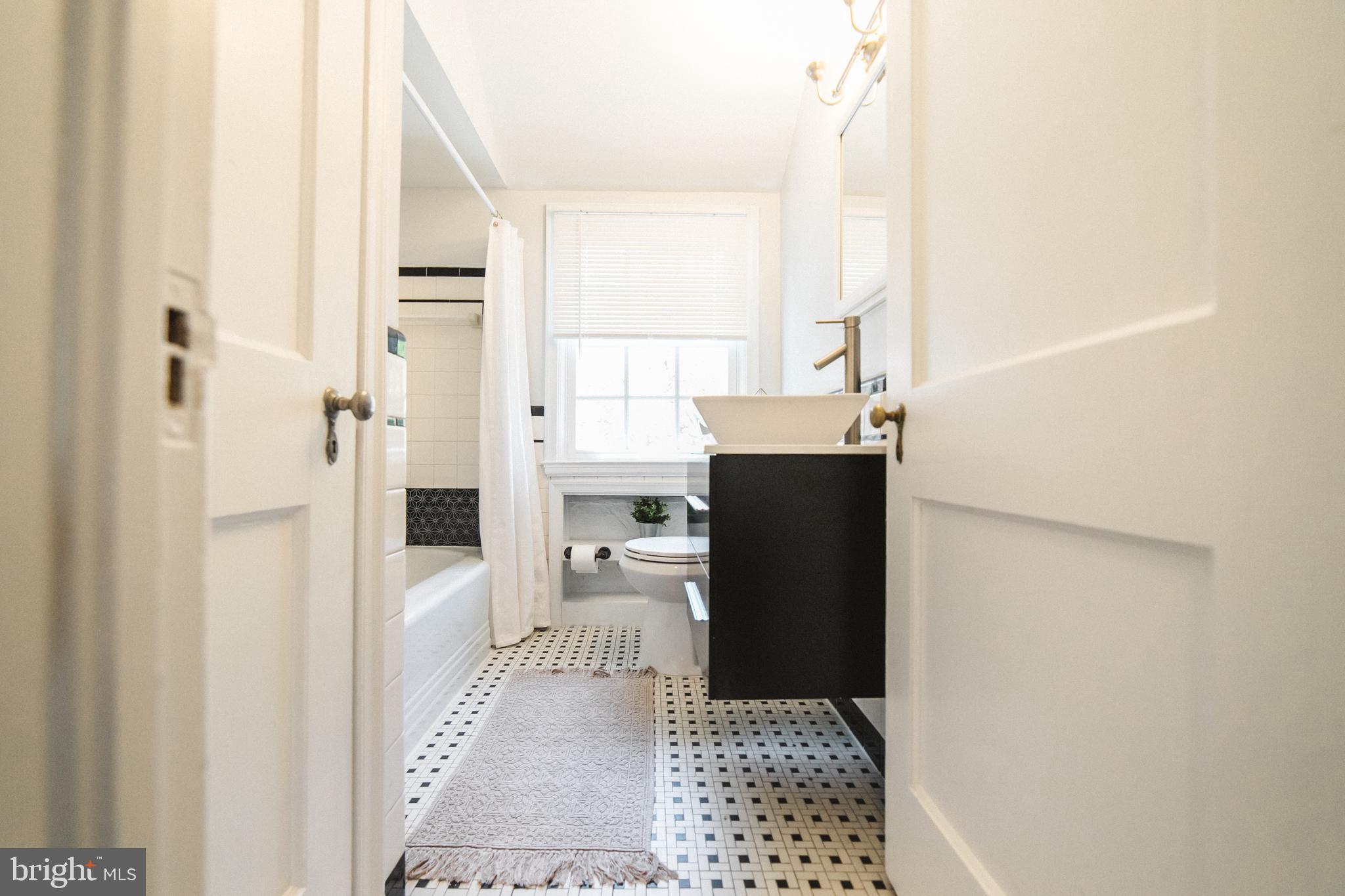 1332 Northview Road Baltimore, MD 21218 - Photo 20 of 30 Upper level bath with custom tile work.