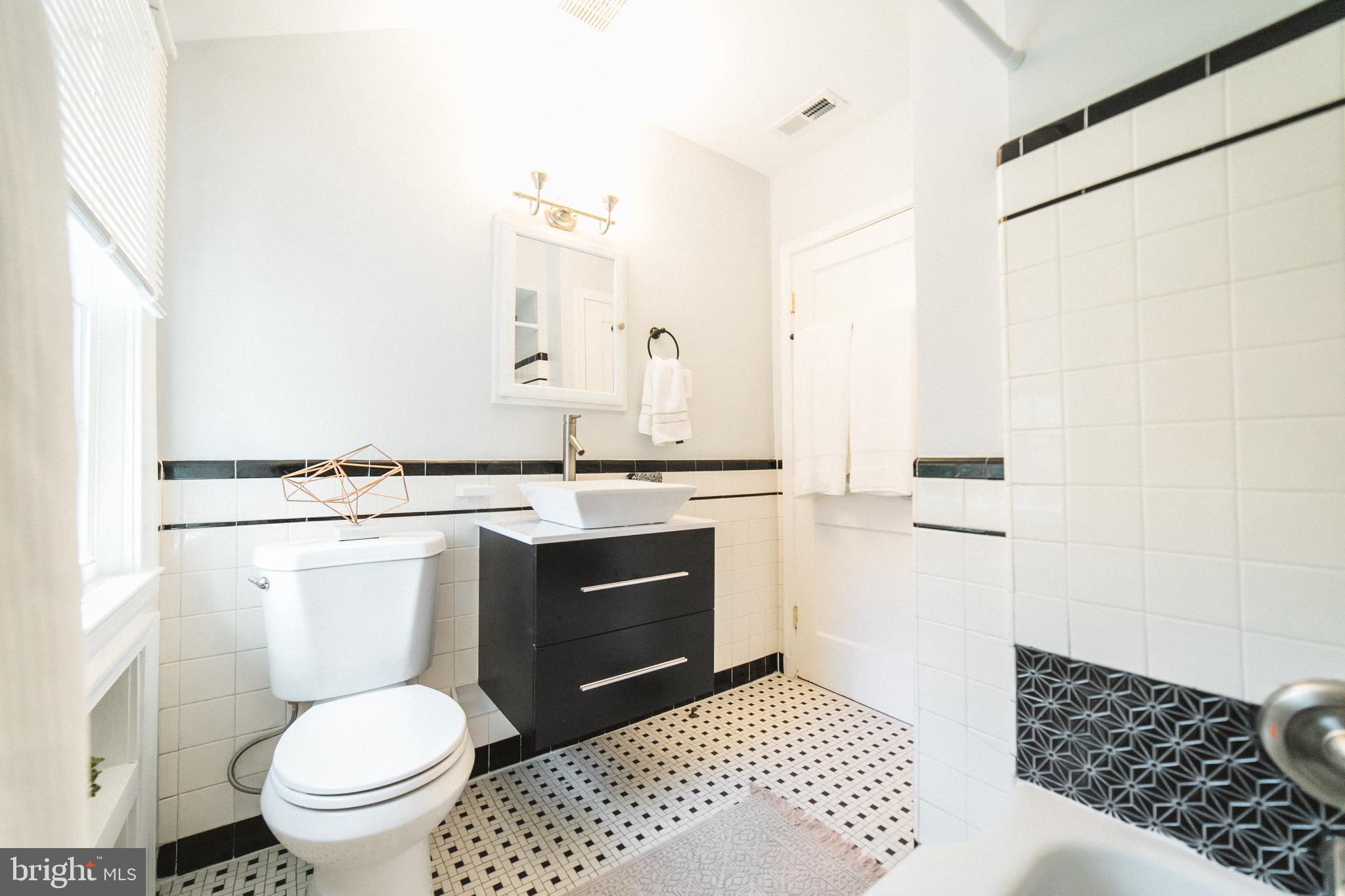 1332 Northview Road Baltimore, MD 21218 - Photo 22 of 30 Upper level bath with custom tile work.