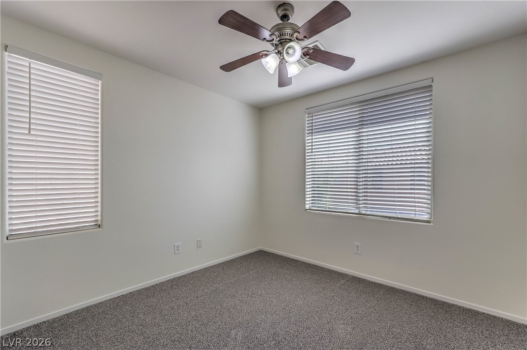 10939 Paradise Road Henderson, NV 89052 - Photo 30 of 36 Well-lit room with plush carpeting offers comfort and quiet relaxation.
