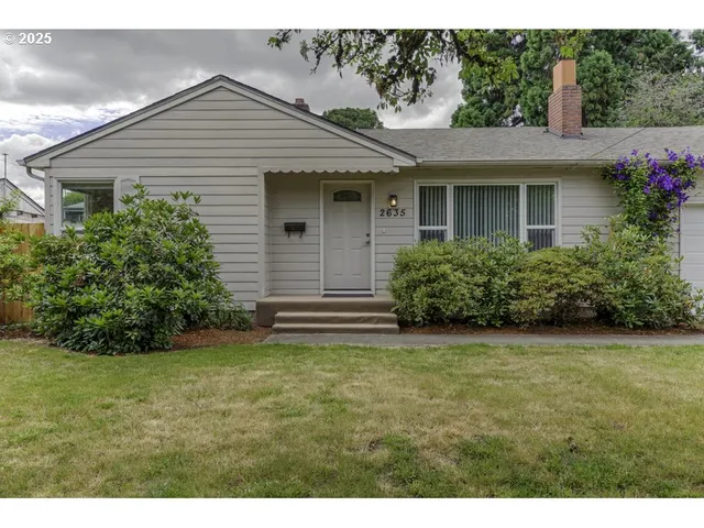 a view of a house with a garden