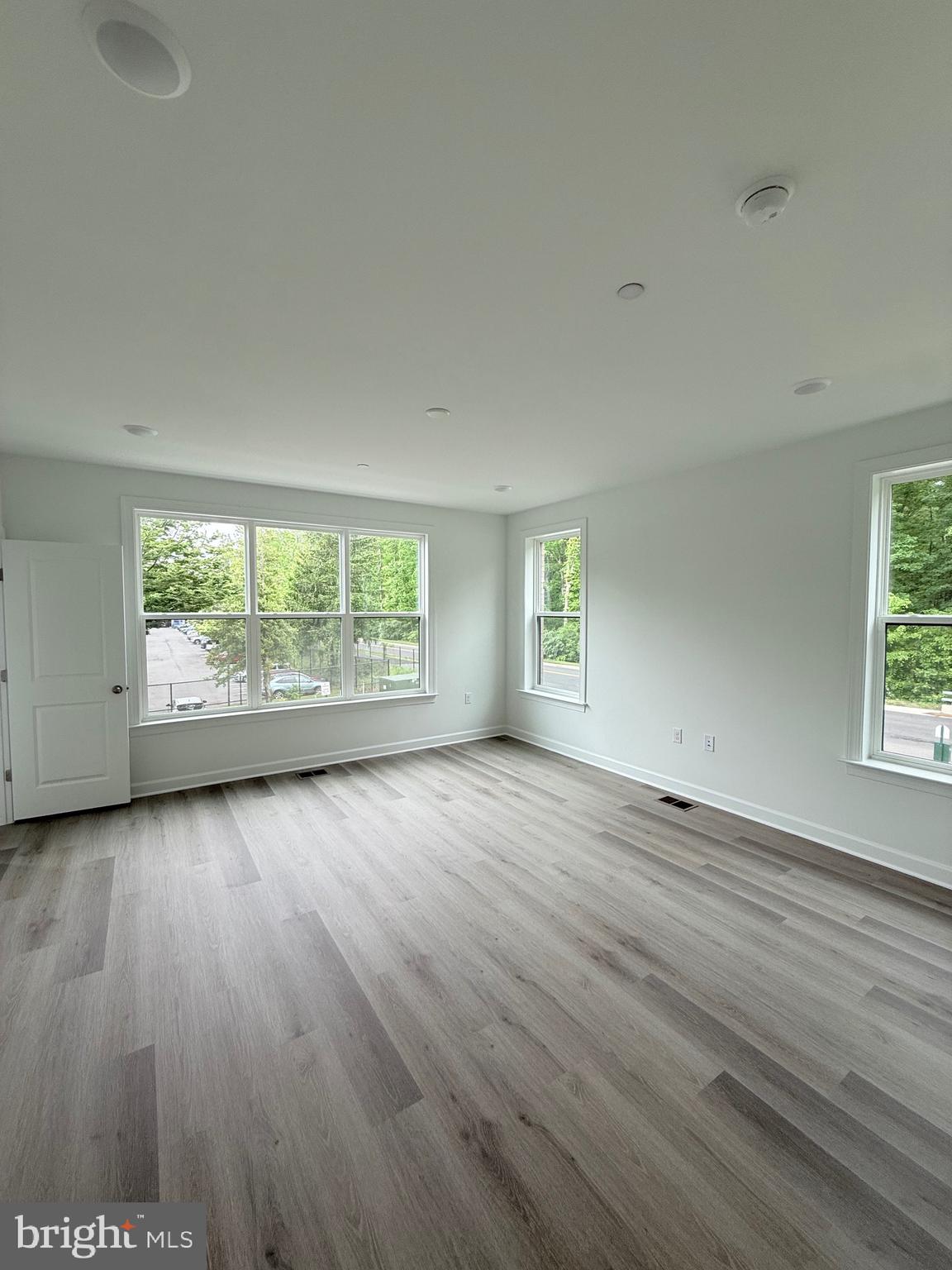 4900 Chelan Crossing Chantilly, VA 20151 - Photo 16 of 27 an empty room with wooden floor and windows