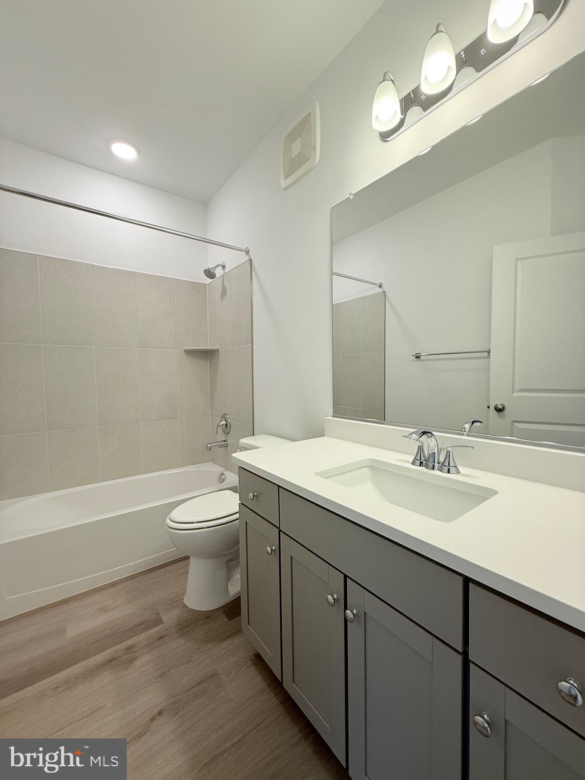 4900 Chelan Crossing Chantilly, VA 20151 - Photo 20 of 27 a bathroom with a granite countertop sink toilet and shower