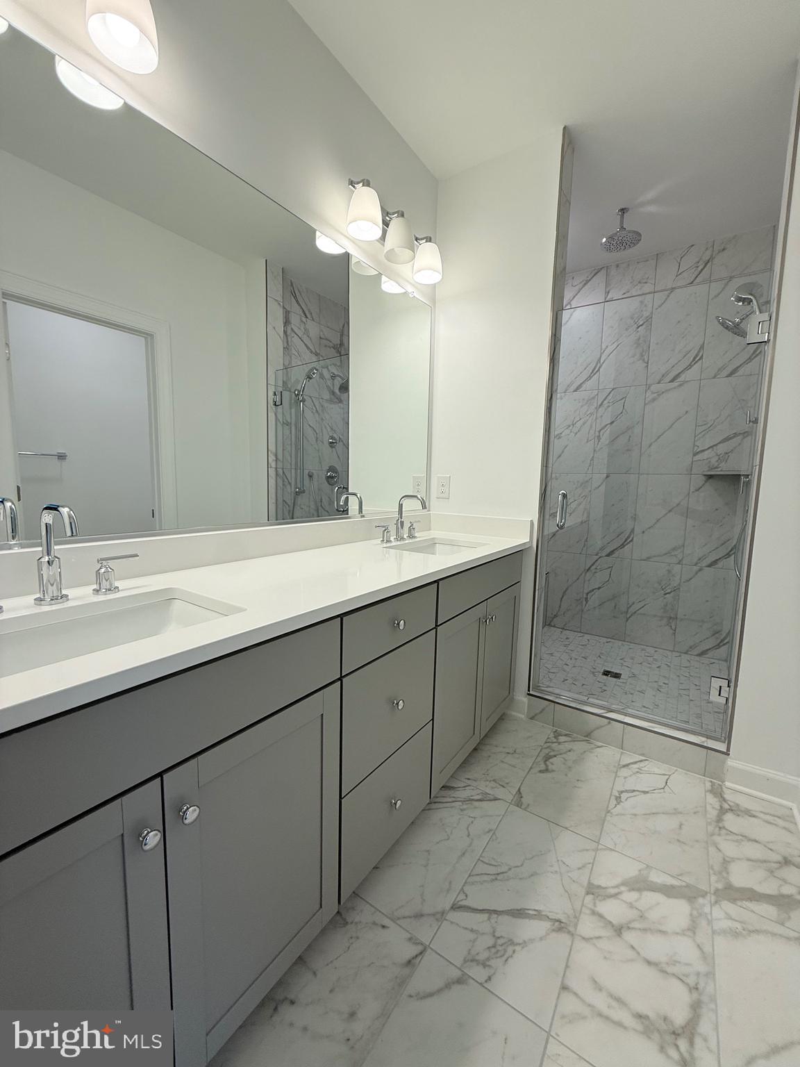 4900 Chelan Crossing Chantilly, VA 20151 - Photo 24 of 27 a bathroom with a double vanity sink mirror and shower
