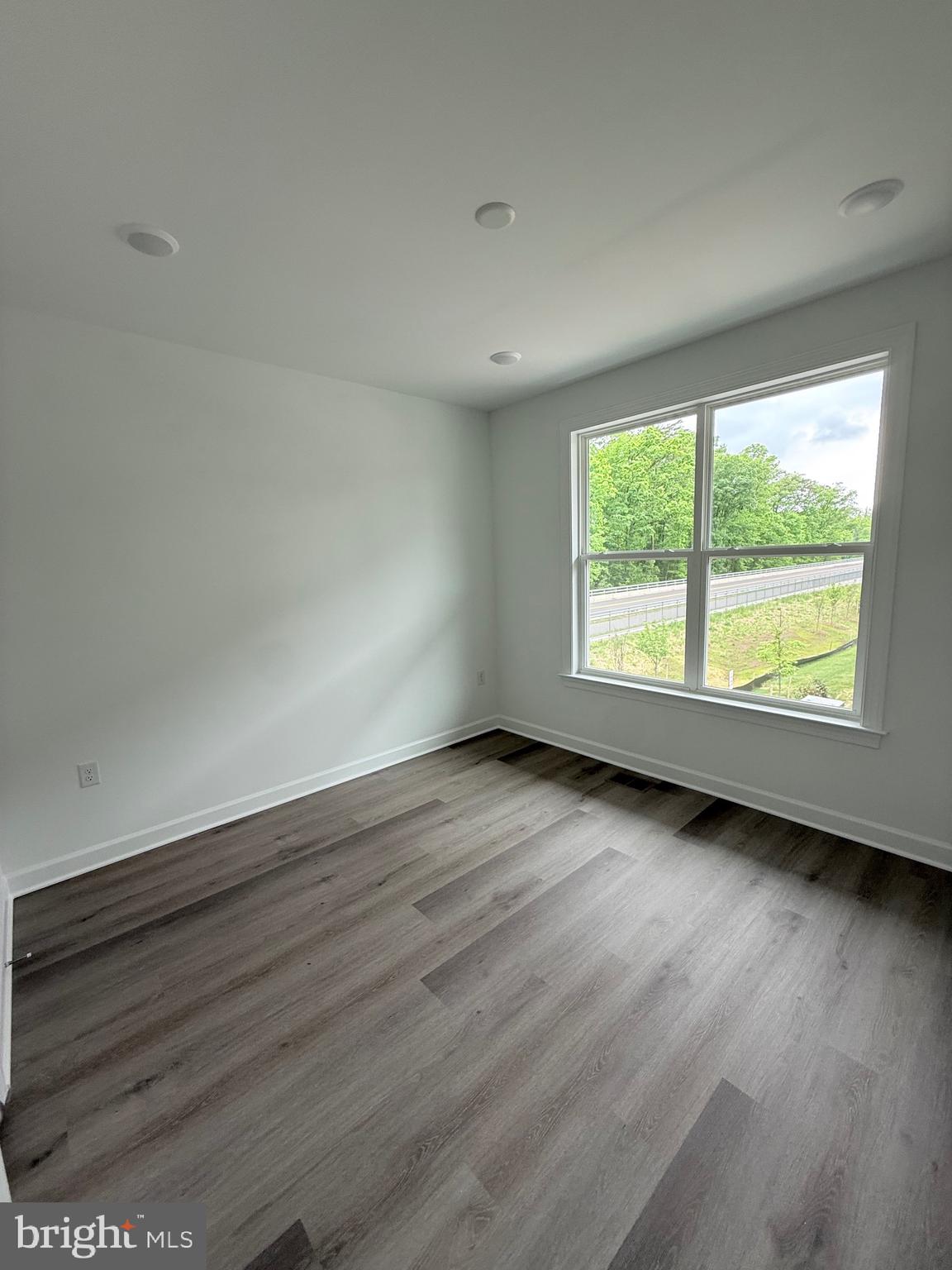 4900 Chelan Crossing Chantilly, VA 20151 - Photo 25 of 27 an empty room with wooden floor and windows