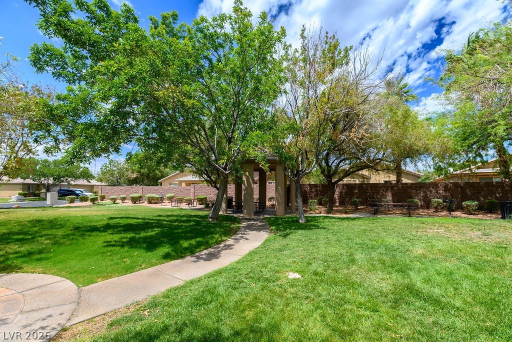 3591 Driving Range Street Las Vegas, NV 89122 - Photo 17 of 79 A tranquil green space featuring a charming gazebo, perfect for relaxation or social gatherings.