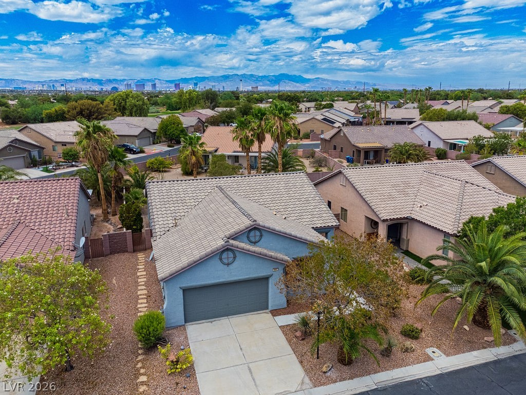 3591 Driving Range Street Las Vegas, NV 89122 - Photo 2 of 79 This inviting residence features a durable tile roof and an attached garage.