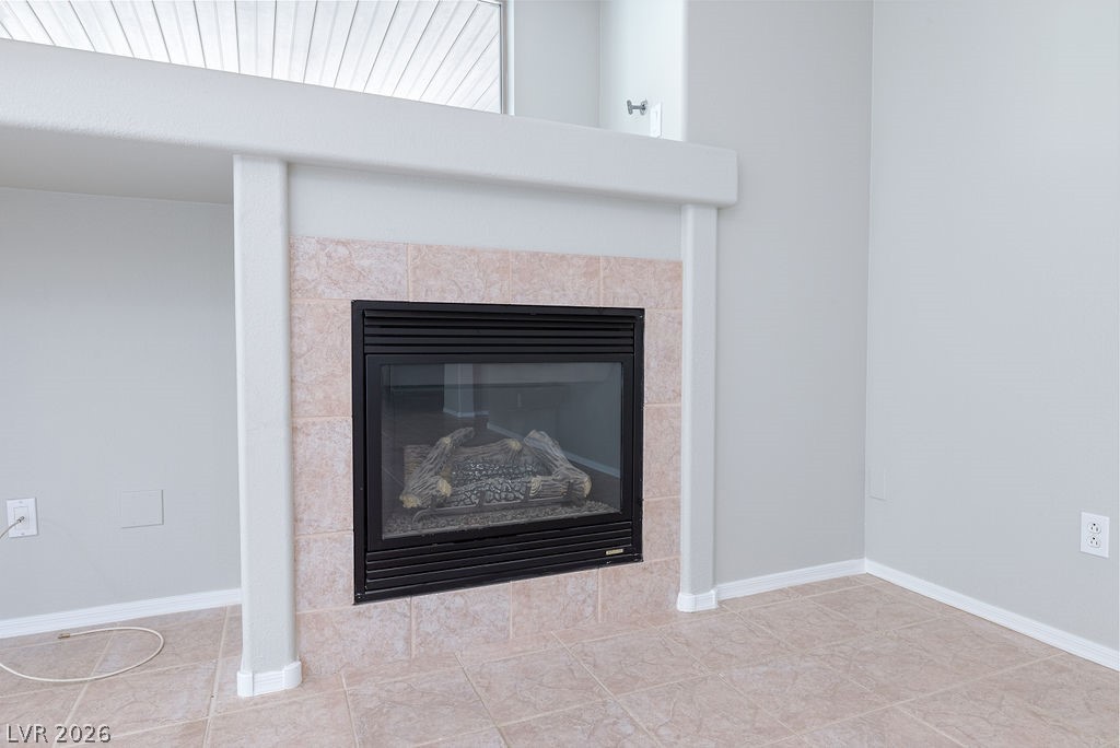 3591 Driving Range Street Las Vegas, NV 89122 - Photo 28 of 79 This inviting fireplace, adorned with elegant tile, creates a warm focal point in any room.