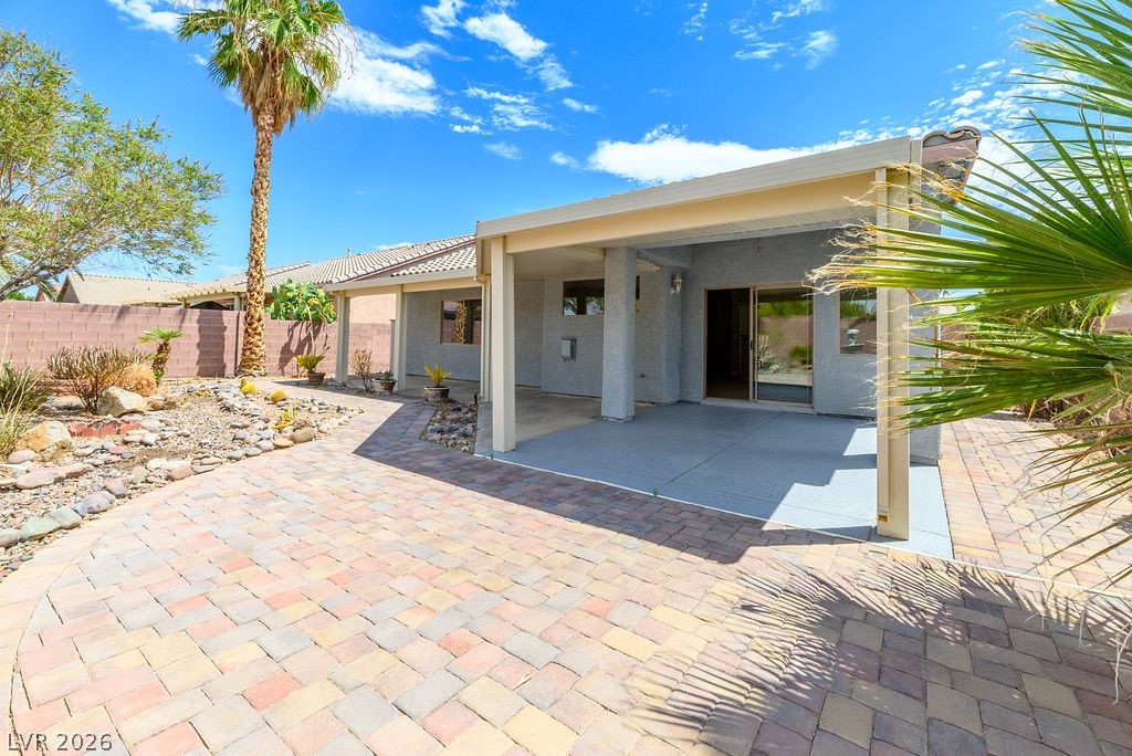 3591 Driving Range Street Las Vegas, NV 89122 - Photo 34 of 79 This private backyard oasis features an expansive covered patio, perfect for outdoor living.