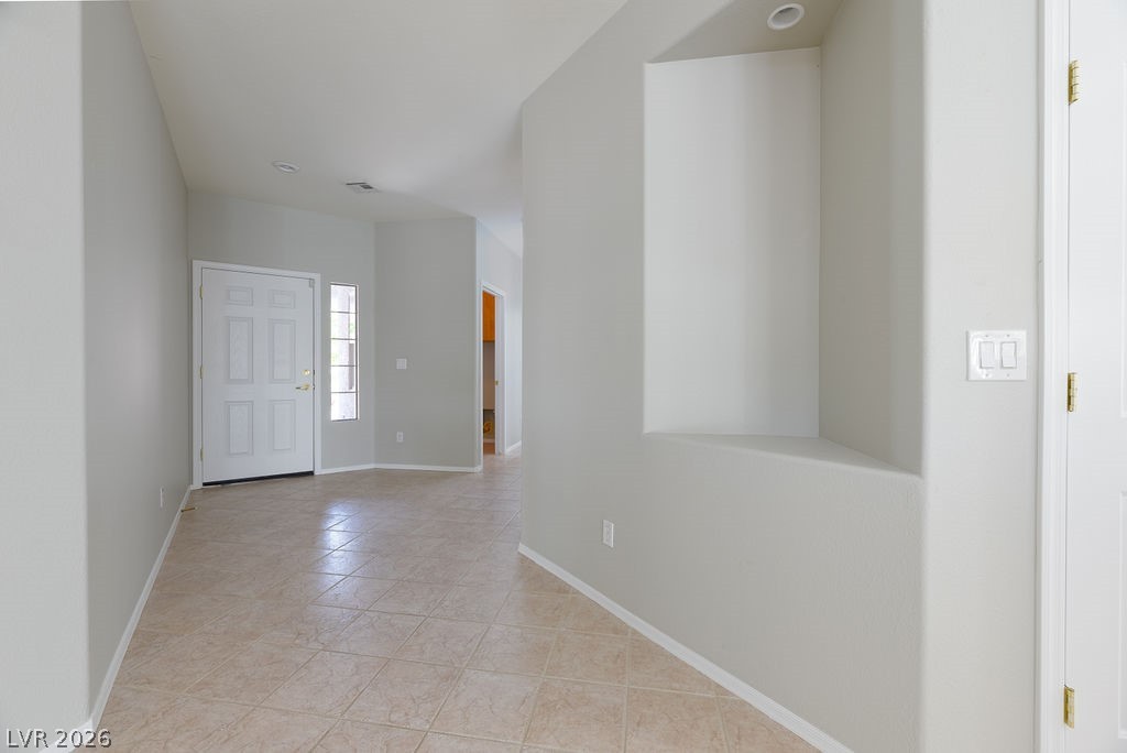 3591 Driving Range Street Las Vegas, NV 89122 - Photo 36 of 79 This bright entry welcomes you with a tiled floor and an intriguing architectural niche, offering a blank canvas for personalization.