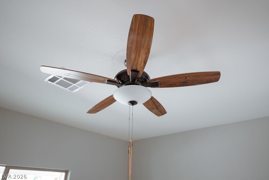 3591 Driving Range Street Las Vegas, NV 89122 - Photo 40 of 79 This living space features a ceiling fan, offering both comfort and functional design.