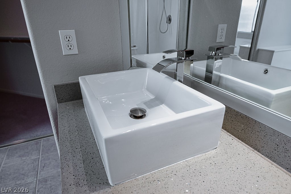3591 Driving Range Street Las Vegas, NV 89122 - Photo 41 of 79 Modern bathroom featuring a sleek vessel sink and durable granite counters.