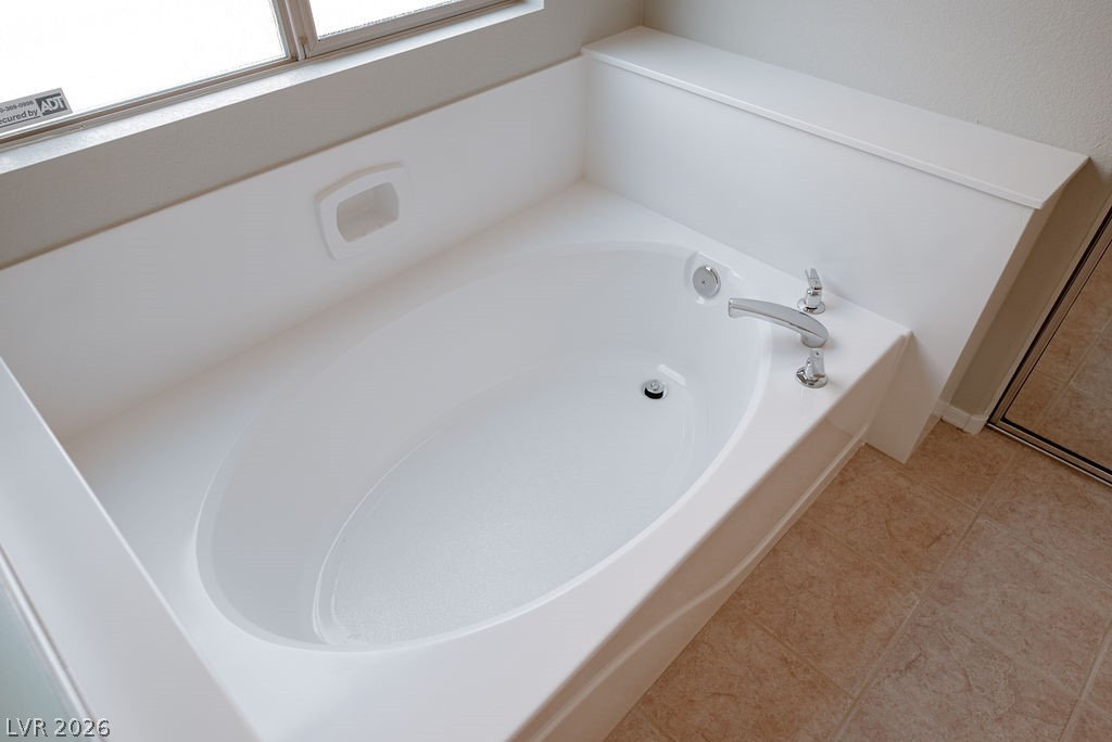 3591 Driving Range Street Las Vegas, NV 89122 - Photo 43 of 79 Relax and unwind in this spacious bathtub, perfect for a soothing soak.