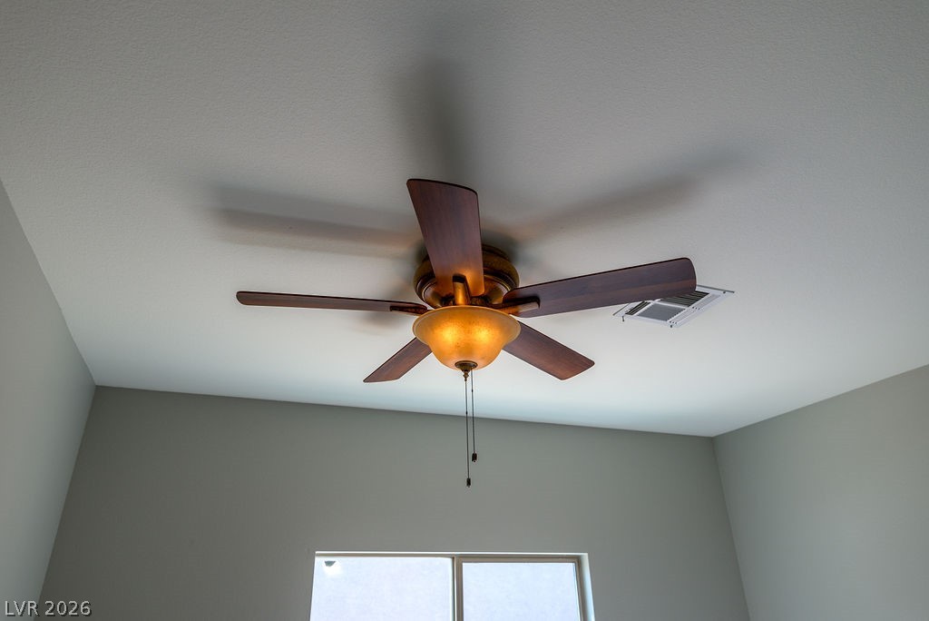 3591 Driving Range Street Las Vegas, NV 89122 - Photo 47 of 79 This spacious room features a ceiling fan, providing comfort and style.