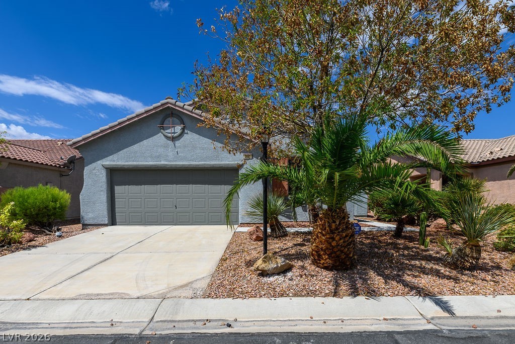 3591 Driving Range Street Las Vegas, NV 89122 - Photo 5 of 79 This desert oasis features a low-maintenance landscape and a two-car garage.