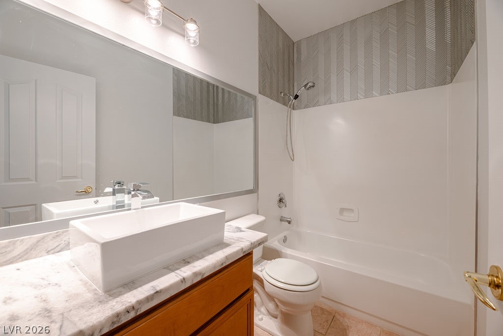 3591 Driving Range Street Las Vegas, NV 89122 - Photo 57 of 79 This bright bathroom offers a contemporary vanity and a classic tub-shower combination.