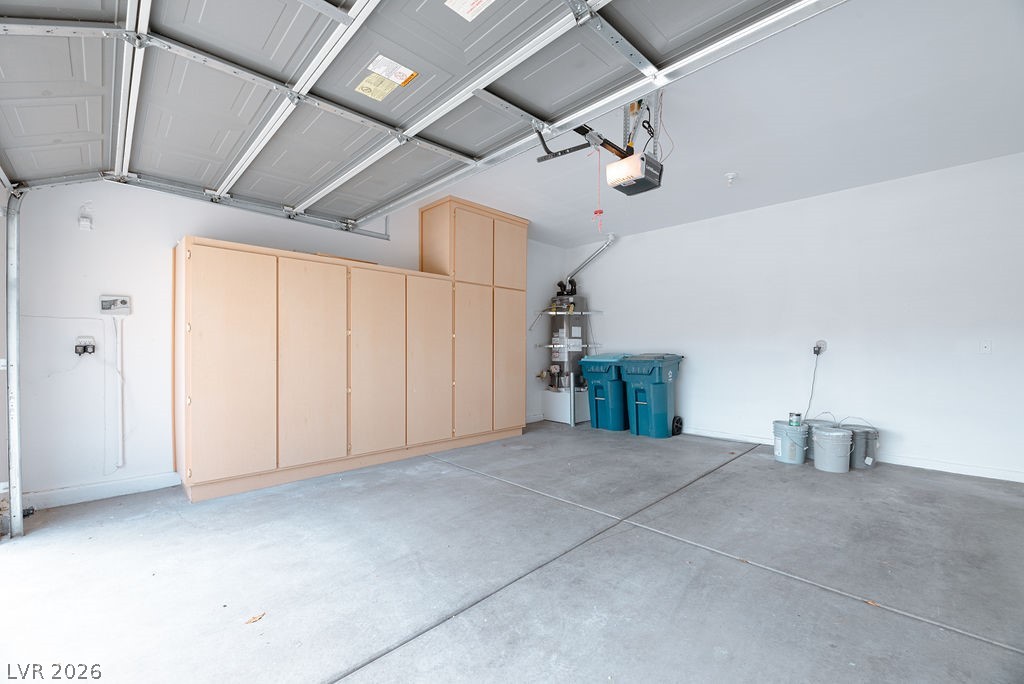 3591 Driving Range Street Las Vegas, NV 89122 - Photo 60 of 79 This spacious garage offers abundant storage solutions and easy access for vehicles.