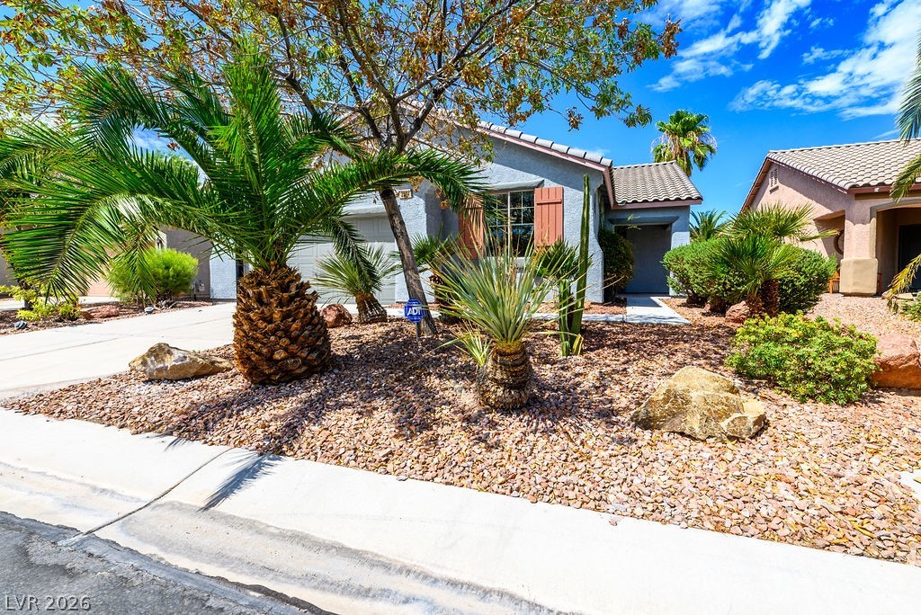3591 Driving Range Street Las Vegas, NV 89122 - Photo 6 of 79 This charming residence features desert-friendly landscaping, creating a low-maintenance exterior.
