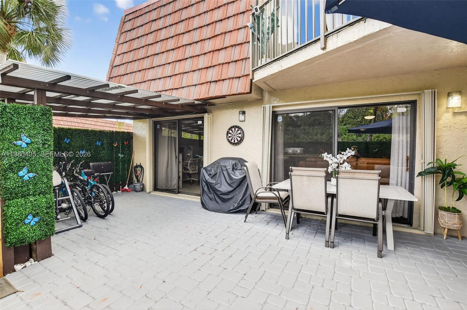 a view of a chairs and table in a patio