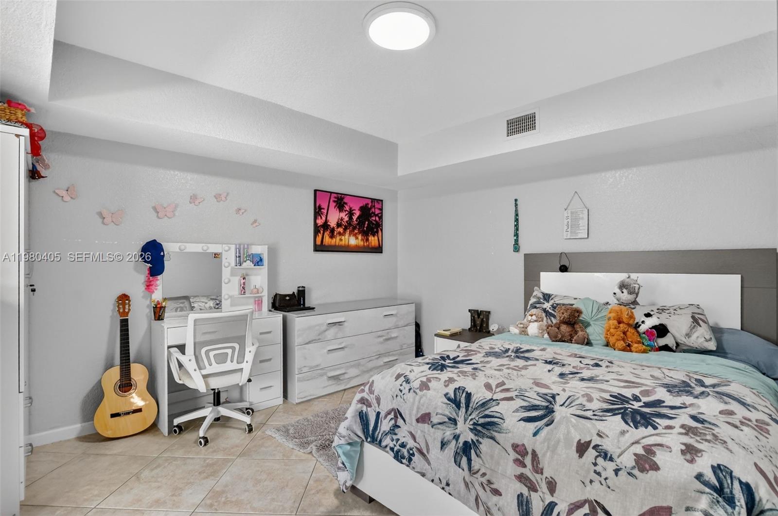 8181 Boca Rio Drive, Unit 8181 Boca Raton, FL 33433 - Photo 12 of 40 a bedroom with a bed and cabinets