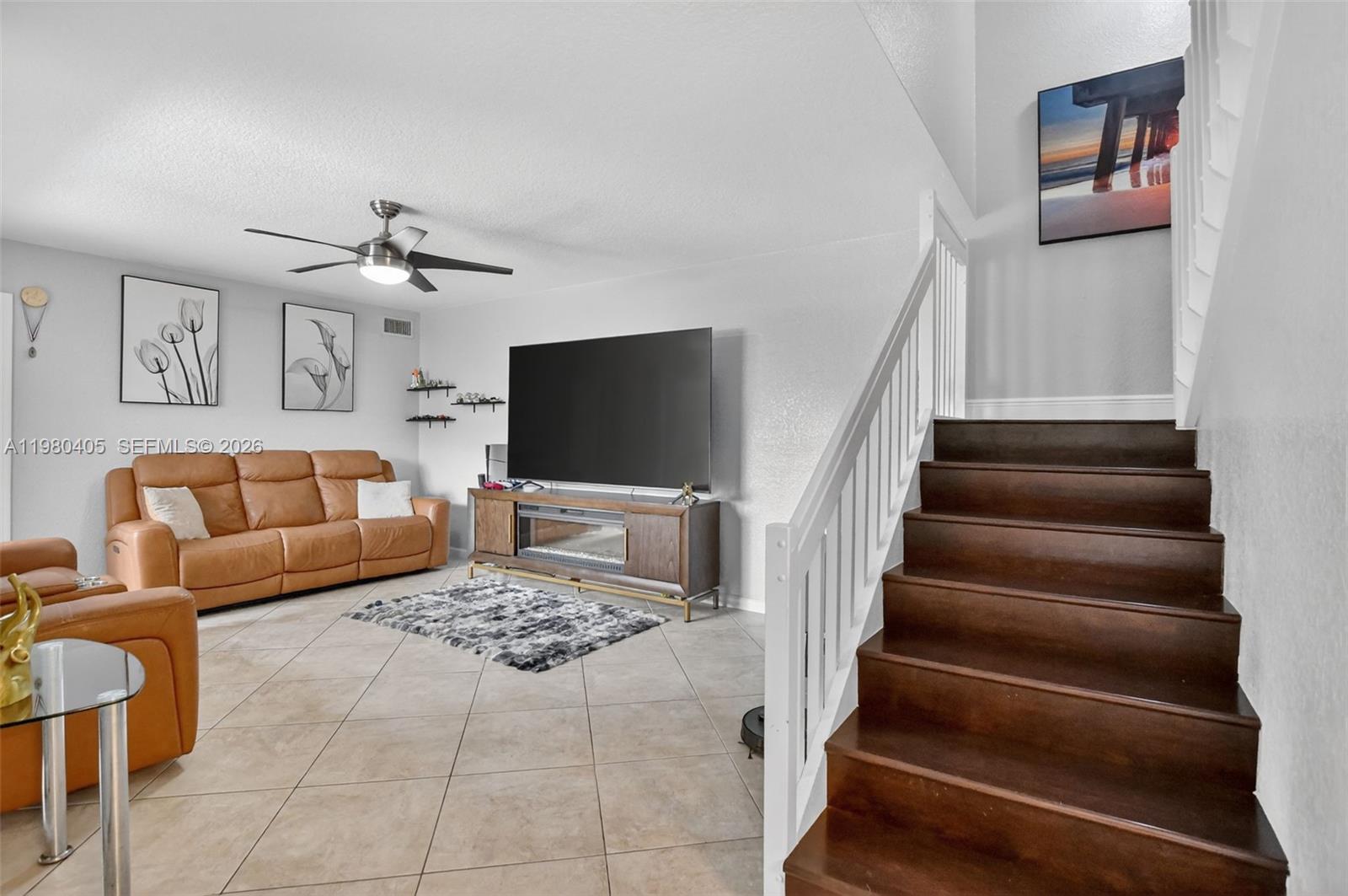 8181 Boca Rio Drive, Unit 8181 Boca Raton, FL 33433 - Photo 19 of 40 a living room with furniture ceiling fan and a rug