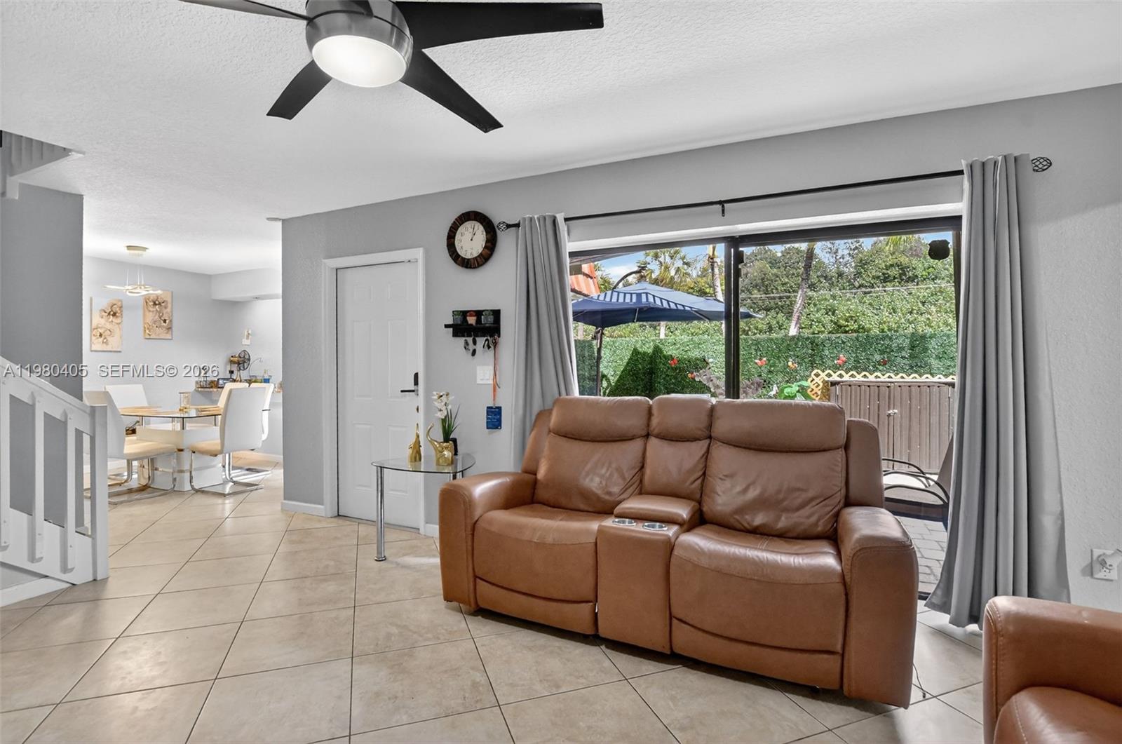8181 Boca Rio Drive, Unit 8181 Boca Raton, FL 33433 - Photo 20 of 40 a living room with furniture and a large window