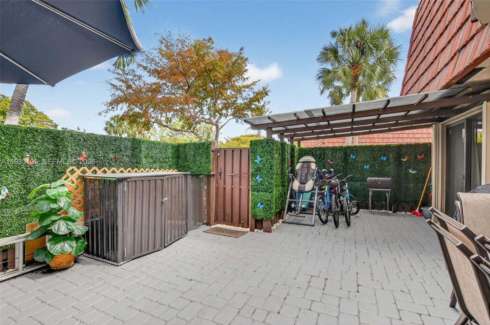 8181 Boca Rio Drive, Unit 8181 Boca Raton, FL 33433 - Photo 2 of 40 a view of outdoor space and porch