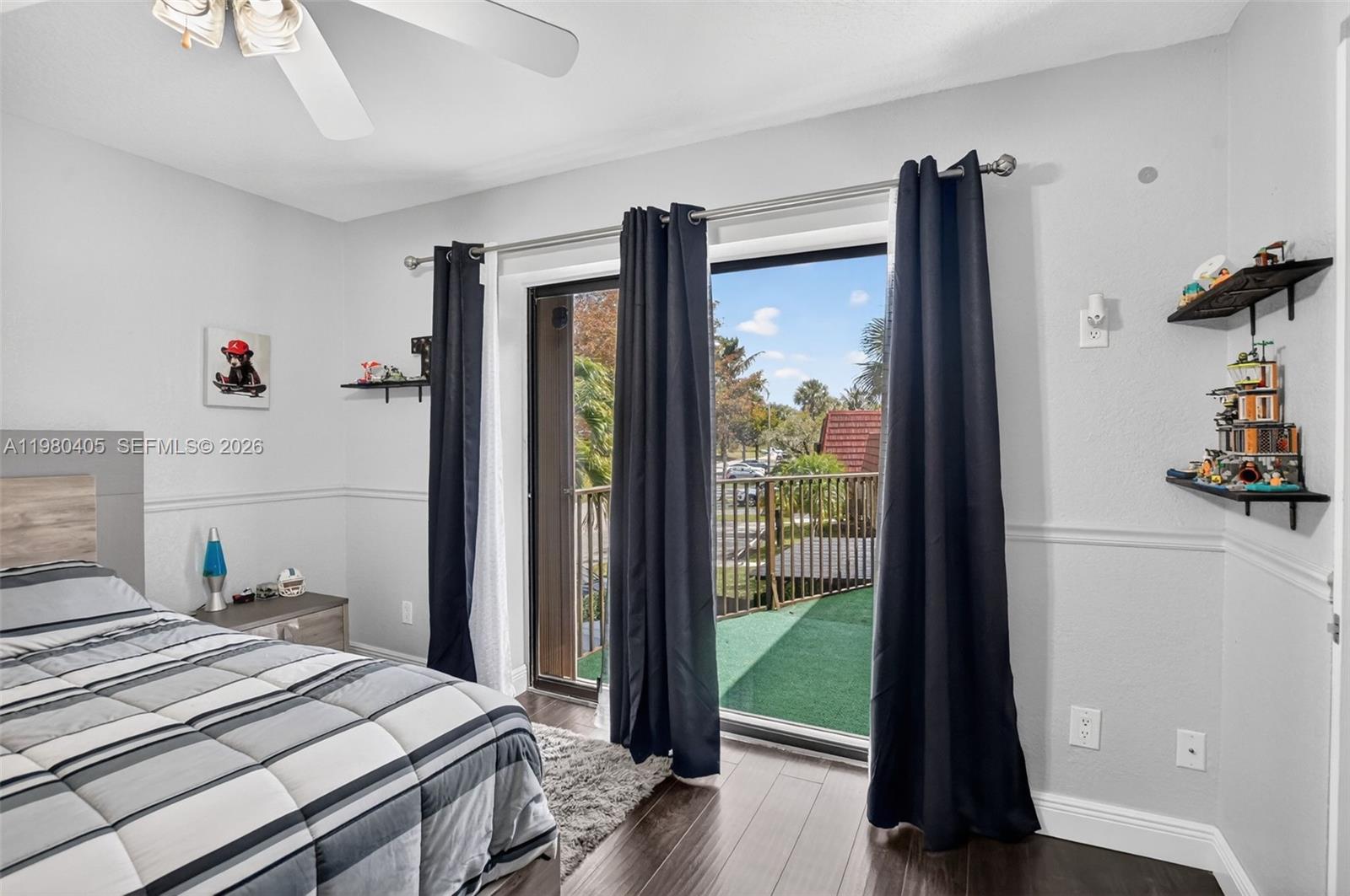 8181 Boca Rio Drive, Unit 8181 Boca Raton, FL 33433 - Photo 23 of 40 a bedroom with a bed and a dresser next to a window